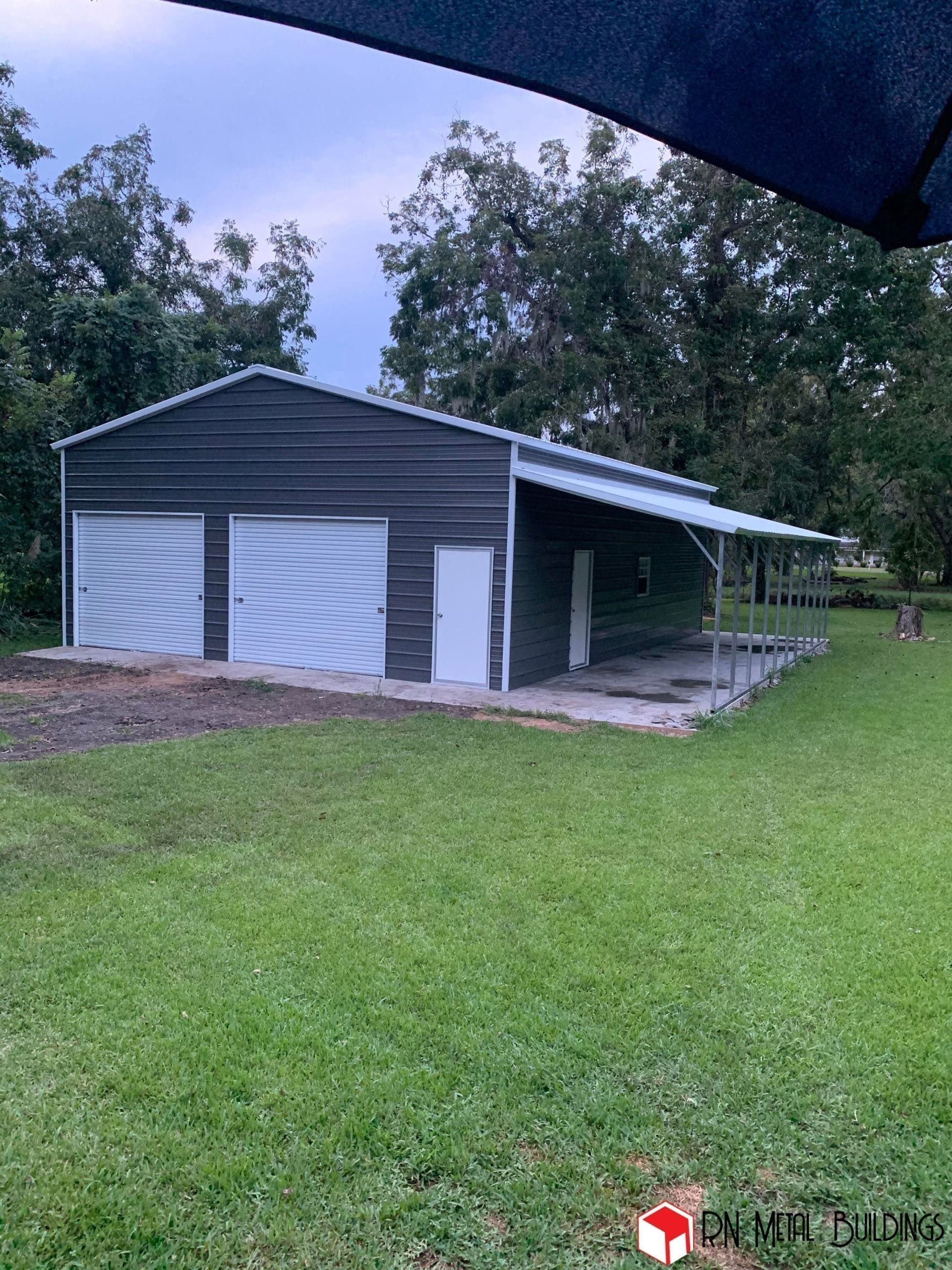 Metal Garage 30x50x12 with a 10x50x8 open lean-to